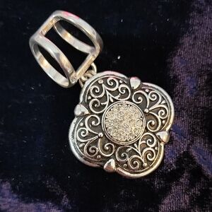 Elegant Silver Pendant with Intricate Design